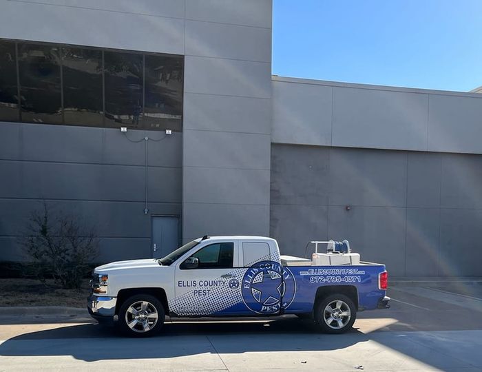 Ellis County Pest Services technician on a job